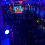 Interior of the Pavillon Cambon during the NFL House event, with the stage, crowd and NFL House sign